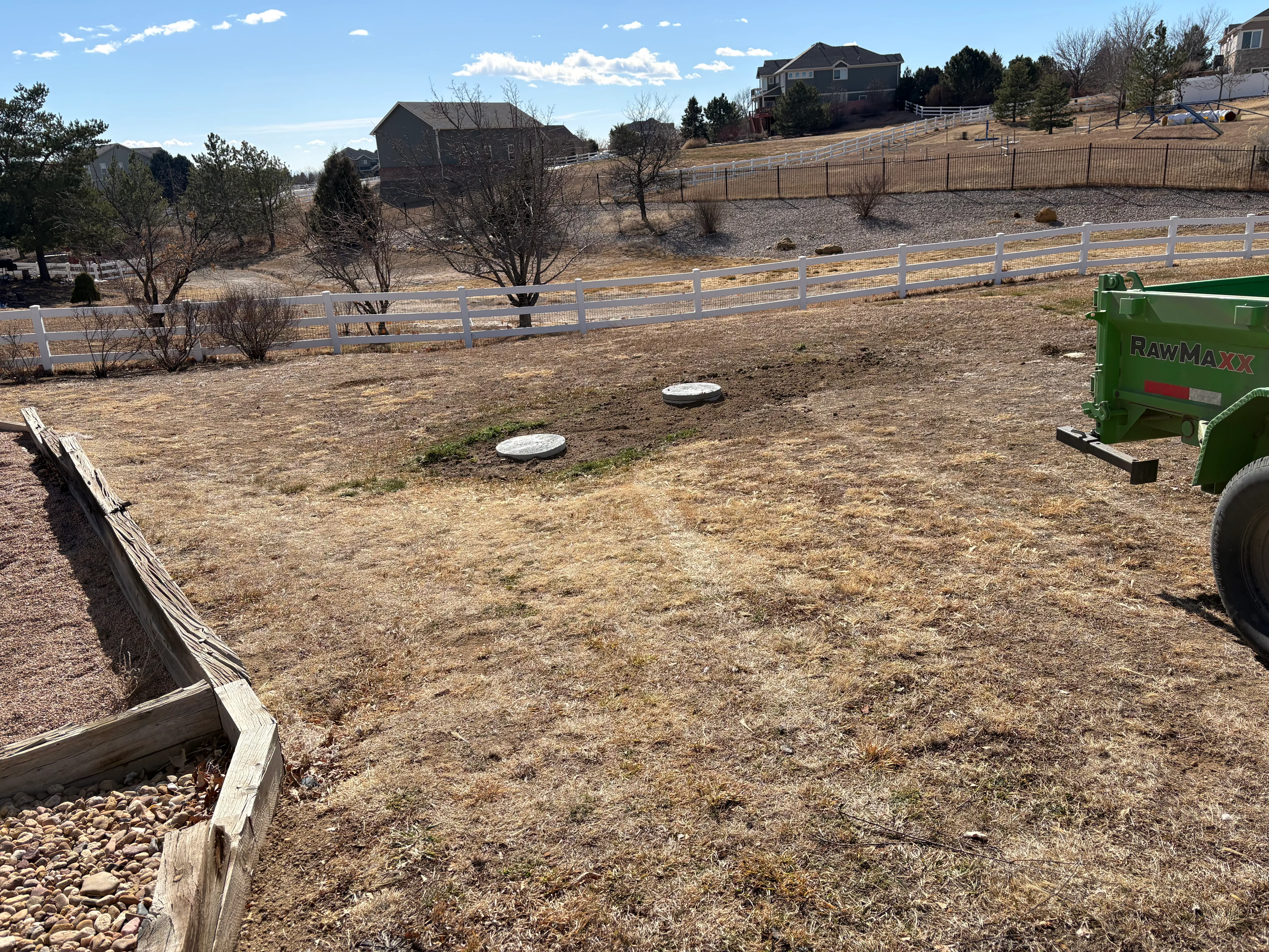 Completed septic install with seamless lawn backfill and low profile risers in Loveland